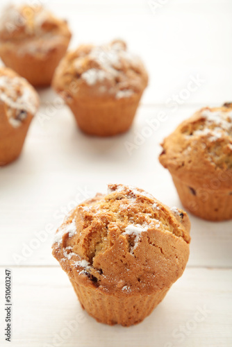 Vanilla muffins. Sweet cupcakes on white background. Top view.