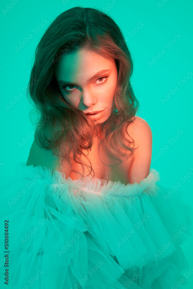 Beautiful woman pose in studio in classic wedding dress Beautiful woman pose in studio in classic wedding dress