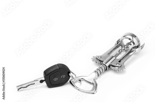 Фотография Car key and bottle opener drunk driving concept
