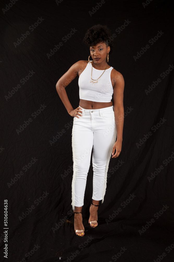 Beautiful Black woman in a white outfit Beautiful Black woman in a white outfit