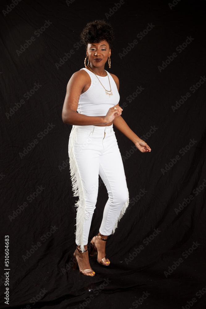 Beautiful Black woman in a white outfit