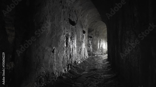 Wet underground arch sewer collector. Old arch dungeon. photo