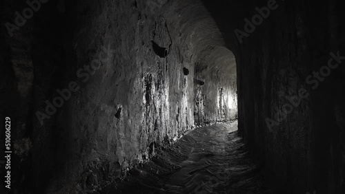 Wet underground arch sewer collector. Old arch dungeon.