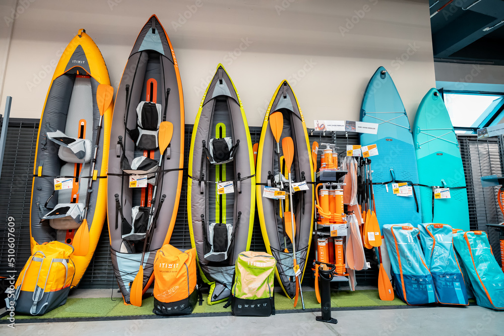 26 May 2022, Antalya, Turkey: A number of inflatable boats and sup boards  in the Decathlon sports equipment store Photos | Adobe Stock