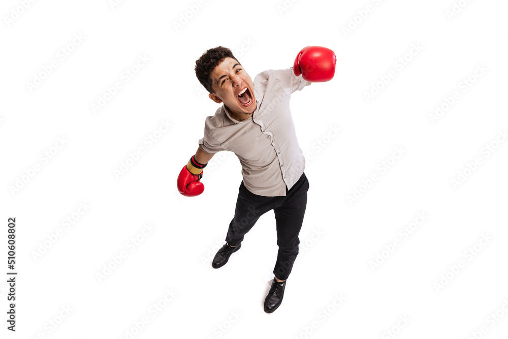Portrait of young man, employee in official cloth anf boxing gloves isolated over white studio background Portrait of young man, employee in official cloth anf boxing gloves isolated over white studio background