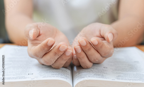 Pray and religion concept, Female christian reading bible and praying for spirituality and faith. photo