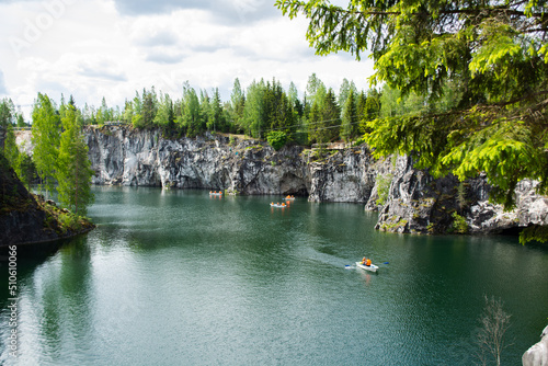 Fototapeta Naklejka Na Ścianę i Meble -  Ruskeala mountain park with marble canyon with boats on the water on a sunny summer day. Republic of Karelia, Russia.