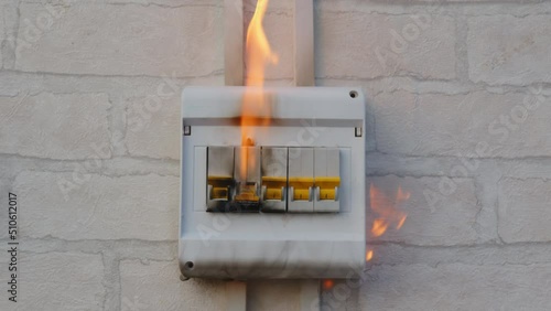 Circuit breaker fire in switch box indoors. Fault contact switching device, malfunction electrical wiring, short circuit, overload.
