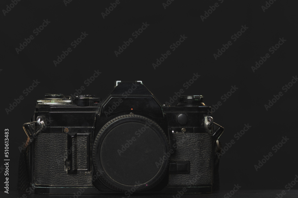old film camera isolated on black