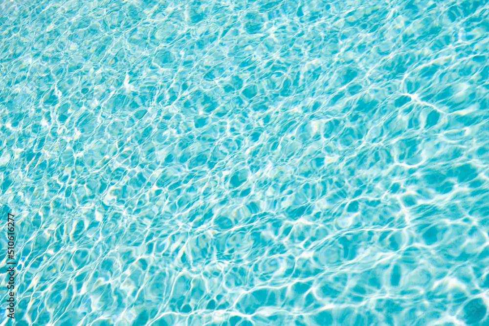 summer blue swimming pool rippled water background