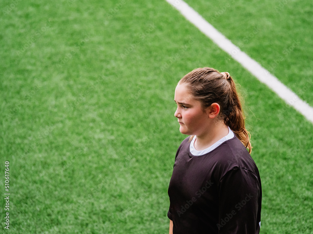 teenage girl on an artificial grass field teenage girl on an artificial grass field