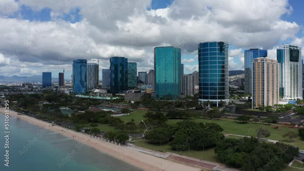 Wide aerial dolly shot along the beachfront of downtown Honolulu on the island of O'ahu, Hawaii. 4K Wide aerial dolly shot along the beachfront of downtown Honolulu on the island of O'ahu, Hawaii. 4K