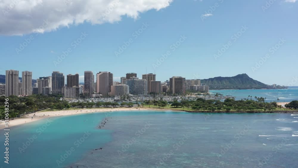 Aerial wide dolly shot of Ala Moana Beach in Honolulu on the island of O'ahu, Hawaii. 4K Aerial wide dolly shot of Ala Moana Beach in Honolulu on the island of O'ahu, Hawaii. 4K
