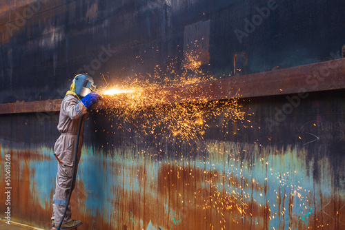 Tableau sur toile Gouging welding spark fire industrial welder wear safety protective mask constru