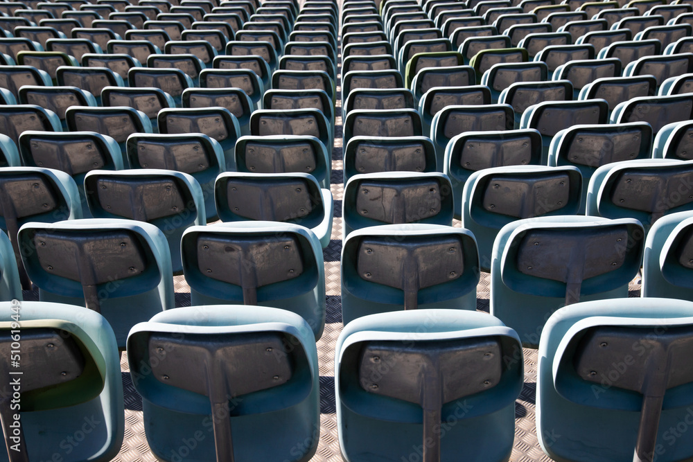 Obraz premium Empty Plastic Chairs at the Stadium