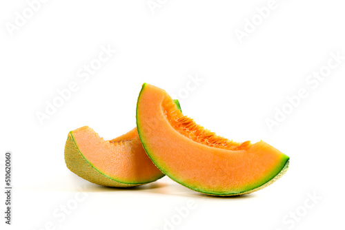 slice of japanese melons, orange melon or cantaloupe melon with seeds isolated on white