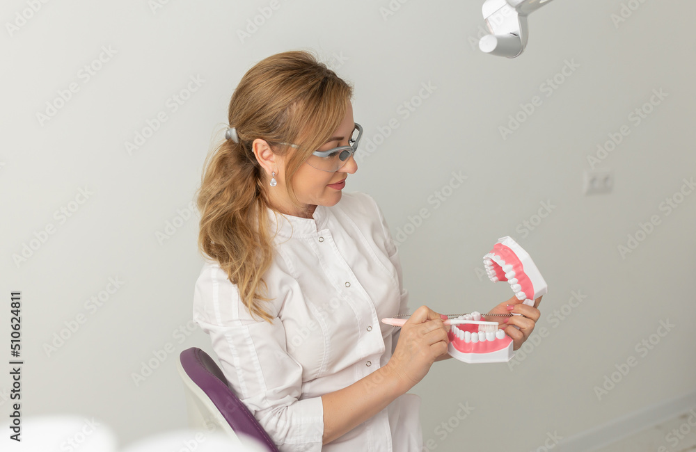Portrait of female dentist in her dentist office Portrait of female dentist in her dentist office
