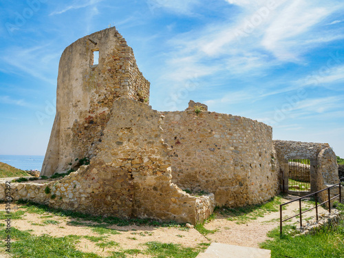 Castle of Sant Esteve at sunny day. La Fosca beach, Catalonia, Spain. photo