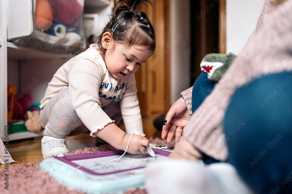 Fototapeta premium Little Girl Drawing at Home