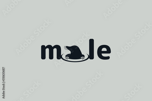 mole logo with a lettering mole with a mole sticking out of the letter 