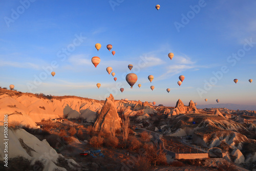 Mountain landscape with air balloons in Goreme, Cappadocia, Turkey photo