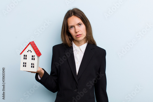 young adult woman feeling sad and whiney with an unhappy look and crying photo