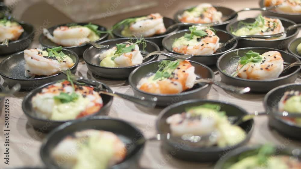 Shrimp and mayonnaise appetizers arranged in small bowl for the buffet Shrimp and mayonnaise appetizers arranged in small bowl for the buffet
