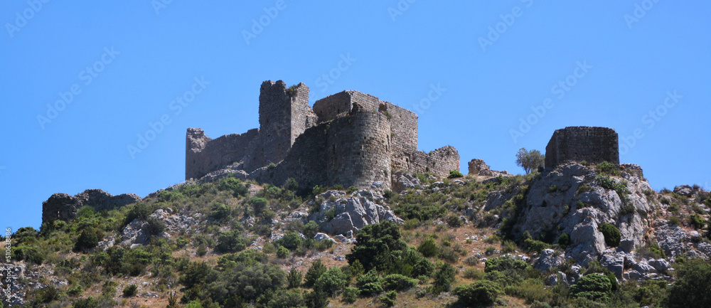 Panoramic view of the medieval Aguilar Castle on top of a mountain near Tuchan, Occitanie region in France