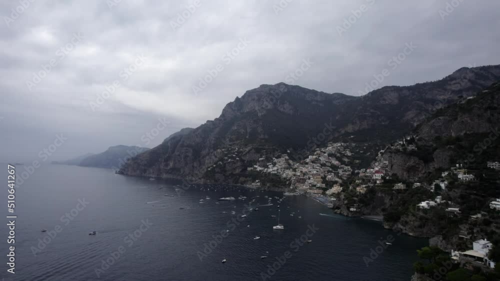 Drone video of a descriptive empty plane on the Amalfi coast in the direction of Praiano, showing the city, its coast and all its splendor. Boats and yachts can be seen in the sea. Drone video of a descriptive empty plane on the Amalfi coast in the direction of Praiano, showing the city, its coast and all its splendor. Boats and yachts can be seen in the sea.