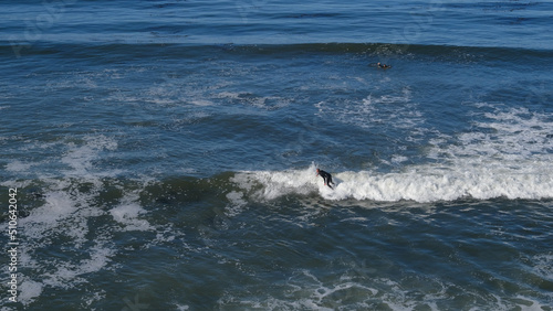 Surfer surfin on the top of the wave, California photo