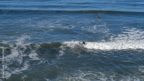 Surfer surfin on the top of the wave, California photo