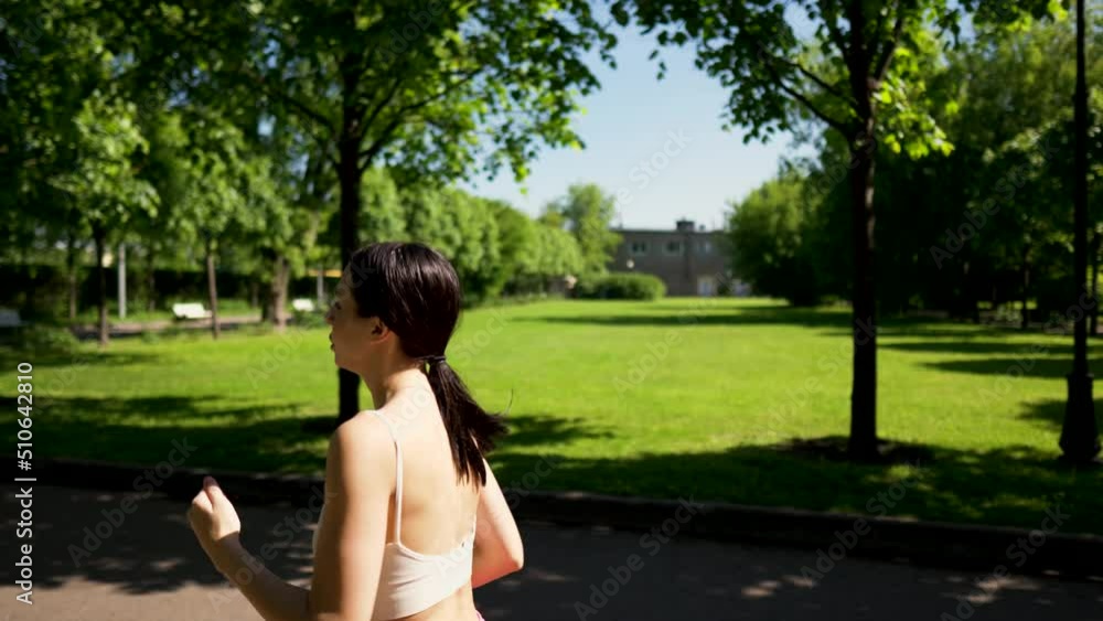 young woman doing exercises in the park young woman doing exercises in the park