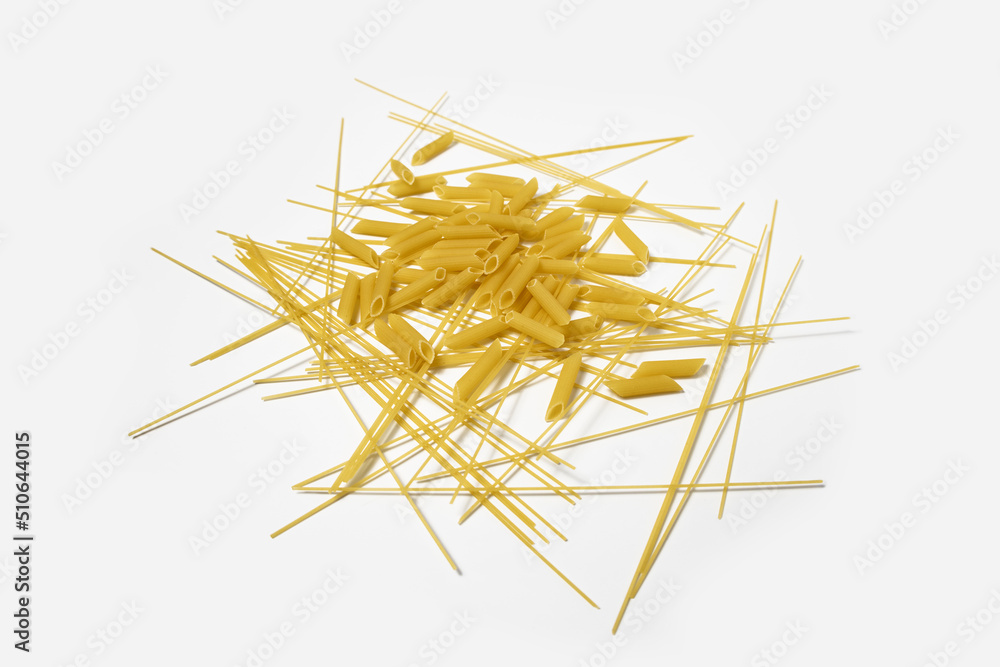 Dry pasta long spaghetti on a white background. Top view, flat lay. Banner. Dry pasta long spaghetti on a white background. Top view, flat lay. Banner.