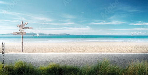 Fototapeta Naklejka Na Ścianę i Meble -  beautiful beach road intentionally blurs the grass in front