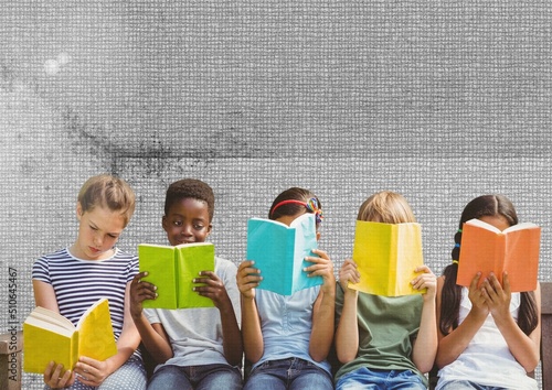 Group of diverse students reading books against textured grey background with copy space