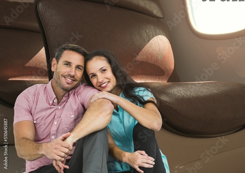 Composite image of caucasian couple smiling against airplane window in background