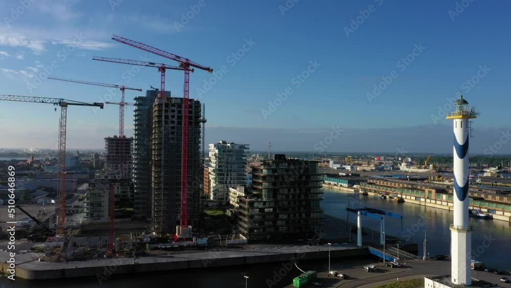Drone flight over Belgian port city Oostende with harbor and beach in the morning Drone flight over Belgian port city Oostende with harbor and beach in the morning