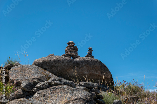 Algumas pirâmides de pedras sobre algumas rochas junto ao baloiço do sobreiro em Castedo, Torre de Moncorvo, Portugal photo