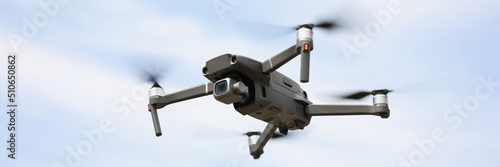 Wallpaper Mural Modern drone device with remote controller flying and filming in air Torontodigital.ca