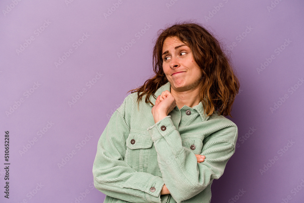Young caucasian woman isolated on purple background confused, feels doubtful and unsure. Young caucasian woman isolated on purple background confused, feels doubtful and unsure.