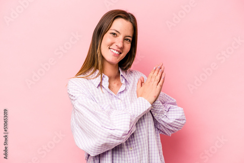 Young caucasian pregnant woman isolated on white background feeling energetic and comfortable, rubbing hands confident.