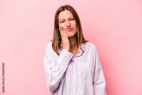 Young caucasian pregnant woman isolated on white background having a strong teeth pain, molar ache.