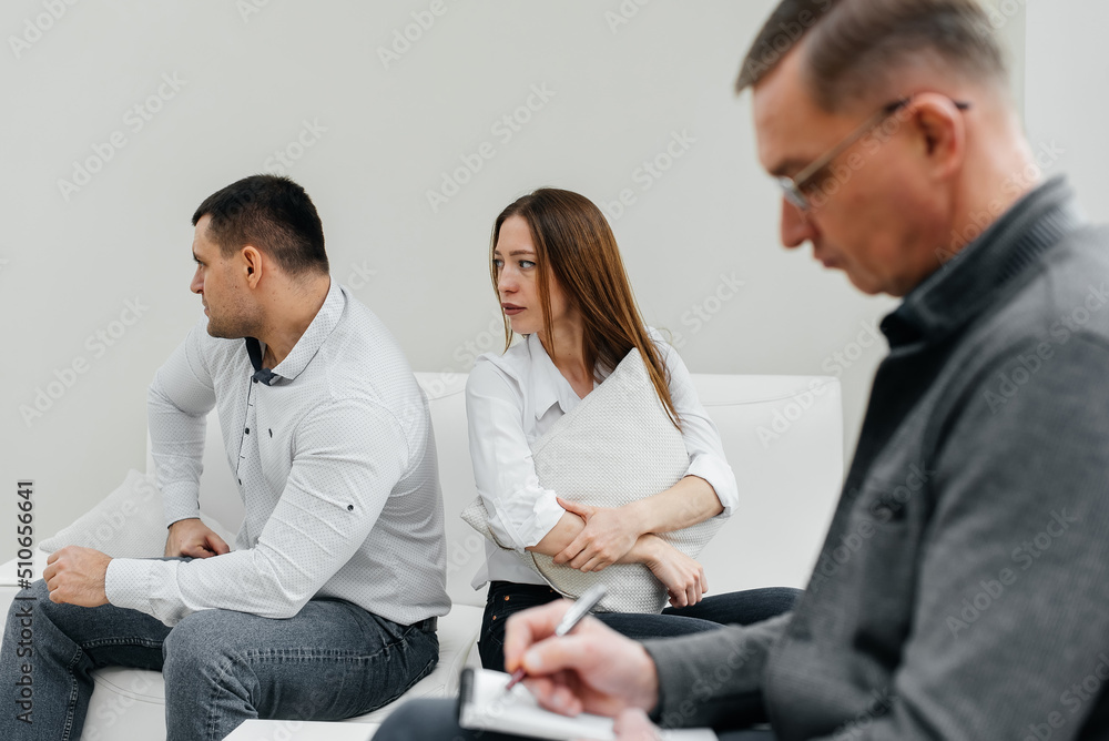 A young married couple came to an appointment and consultation with a psychotherapist. Counseling and help during depression and solving family problems. A young married couple came to an appointment and consultation with a psychotherapist. Counseling and help during depression and solving family problems.