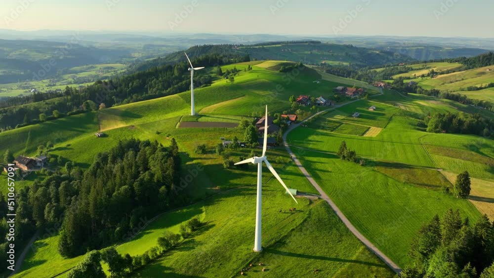 beautiful countryside with modern wind farm, renewable energy and sustainable development concept, wind turbines in green meadows, alternative energy, natural electricity 