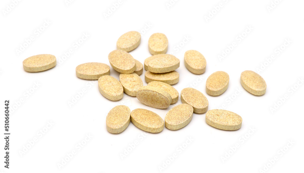 Brown pills, medicine isolated on white background, top view Brown pills, medicine isolated on white background, top view