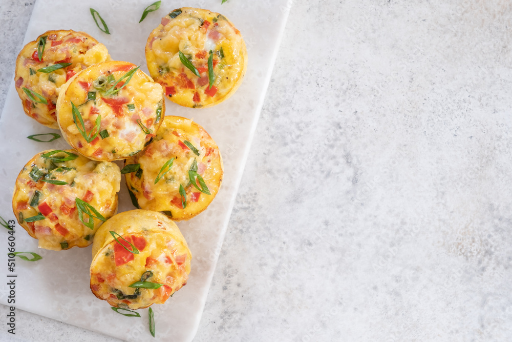 Delicious egg muffins with ham, cheese and vegetables Delicious egg muffins with ham, cheese and vegetables