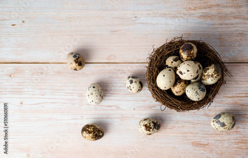 Easter flat lay with quail eegs in the nest.Rustic concept. April holidays