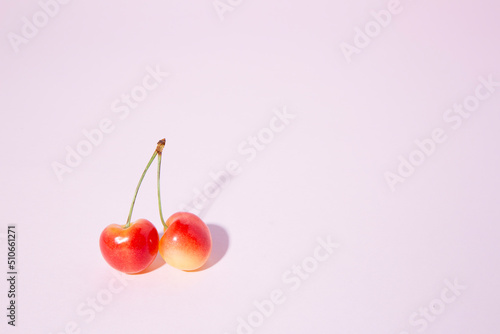 cherries on a pink background