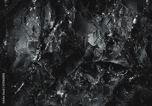 Grunge Rough structure. Black texture. Stone background. Dark marble. Rock texture. Rock surface with cracks. Rock pile. Paint spots wall. Abstract texture.