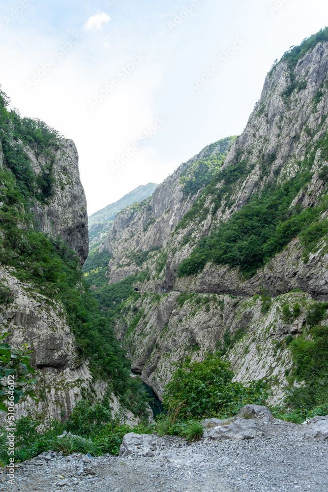 Narrow mountain gorge Plateau or canyon in Montenegro between the cities of Podgorica and Kolasin. Оne of the deepest and narrowest gorge in canyon of the Moracha River. Vertical image